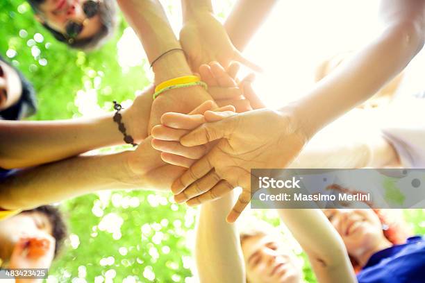 Group Of People Holding Hands Stock Photo - Download Image Now - Adolescence, Adult, Arms Outstretched