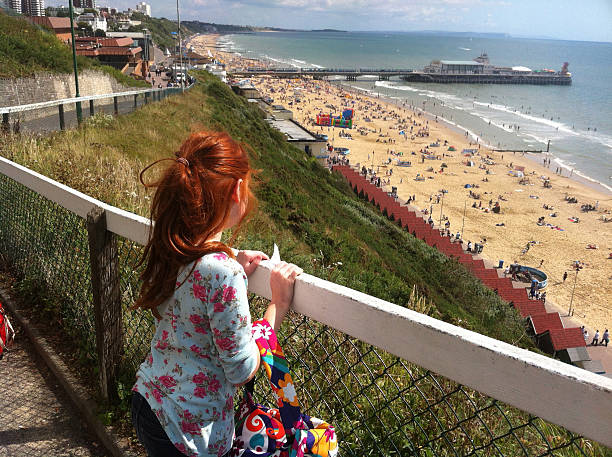 Image showing view over Bournemouth beach Photo of a little girl looking from a cliff at Bournemouth beach boscombe photos stock pictures, royalty-free photos & images