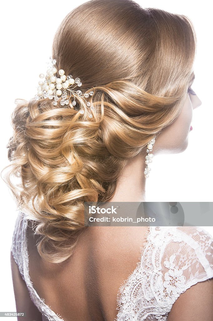 Beautiful  woman in image of the bride. Beauty hair. Hairstyle Portrait of a beautiful  woman in image of the bride. Picture taken in the studio on a black background. Beauty hair. Hairstyle back view Wedding Stock Photo