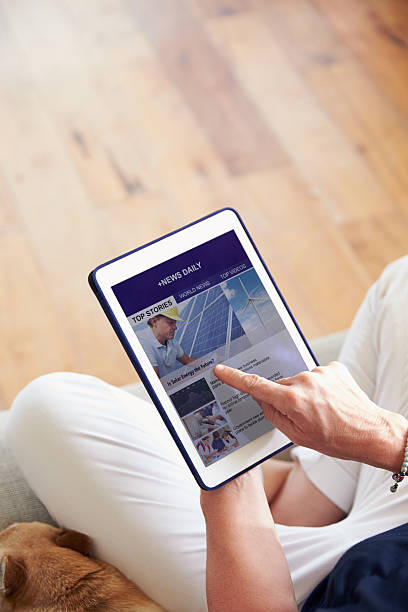 istock Woman Looking At News App On Digital Tablet 483426054