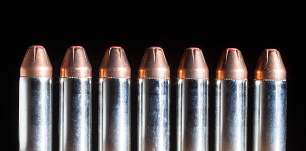 istock Handgun cartridges with red tipped bullets 483426128