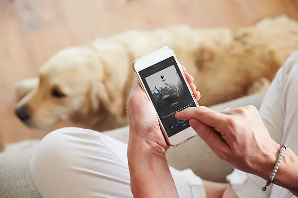 Photo of Close Up Of Woman Listening To Music Smartphone At Home