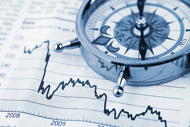 istock Compass on stock market charts 483429592