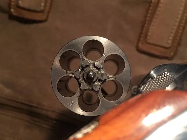 The open cylinder of this revolver makes a unique geometric pattern.