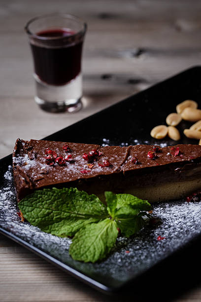 istock Chocolate and Peanut butter Cake and Porto wine cup 483434098