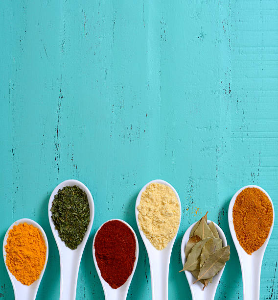 istock Colorful Cooking Spices On Wooden Table 483434258