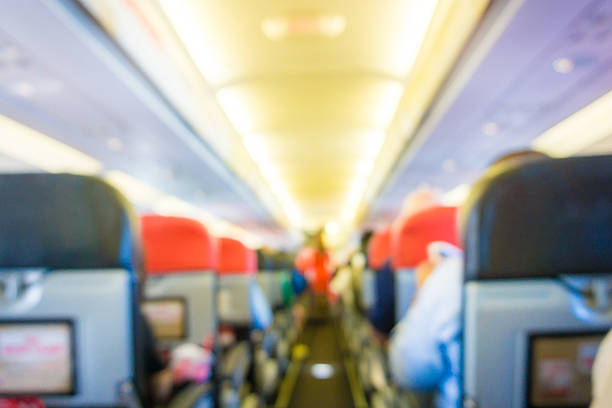 istock Blurred background of Airplane interior 483436116