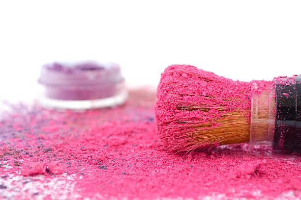 istock Pink and purple makeup powder and brush. 483436500