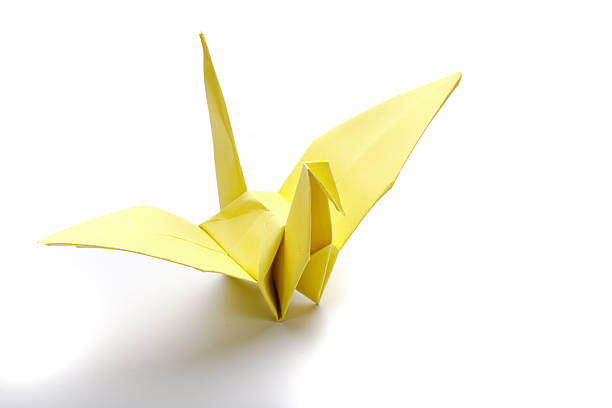 istock Yellow bird origami paper. 483436602