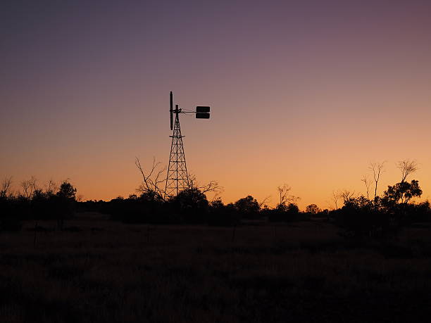 istock Windmill in front of sunset sky 483436902