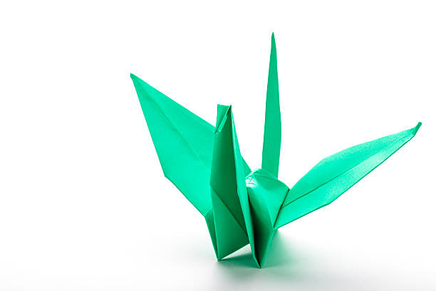 istock Green bird origami on white background. 483437410