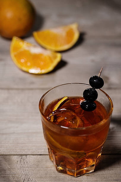 istock Ice tea on wood table and orange quarters 483439556
