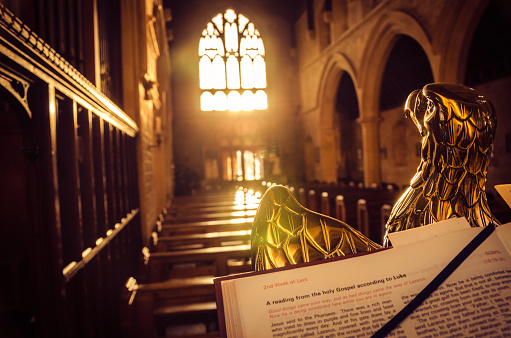 Bible open on an eagle lectern in an English church.