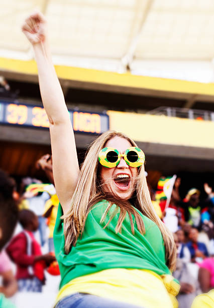 istock Ecstatic female Brazilian soccer fan cheering on her team 483449067