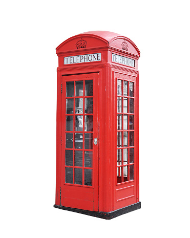 Red telephone box isolated on a white background.