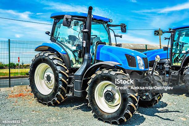 New Blue Farm Tractor For Sale Stock Photo - Download Image Now - New, Tractor, Agricultural Equipment