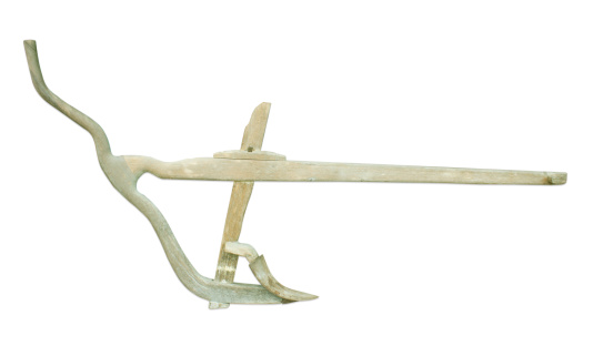 Agricultural old manual plow isolated over white background