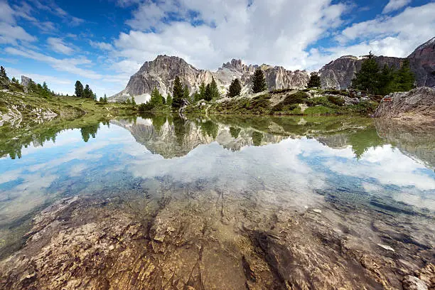 Mount Lagazuoi reflected in a beautiful mountain lake - Dolomites, Italian Alps.