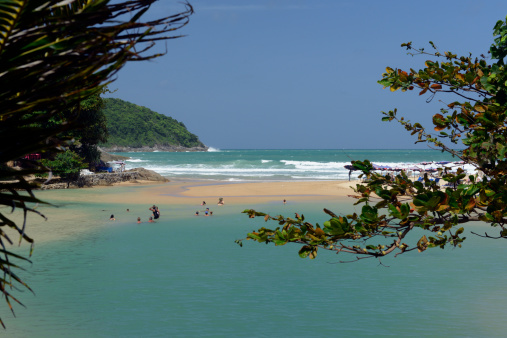 A beach in Hat Nai Harn in the south of the island of Phuket in the south of Thailand in South East Asia.