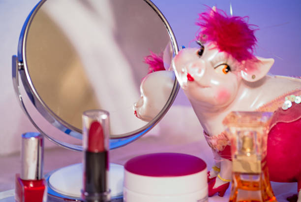 mirror desktop look pink pig toy stock photo