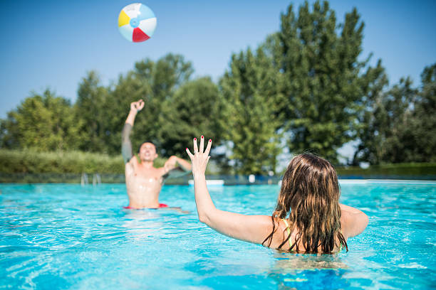 istock Young friends play in swimming pool 483455664