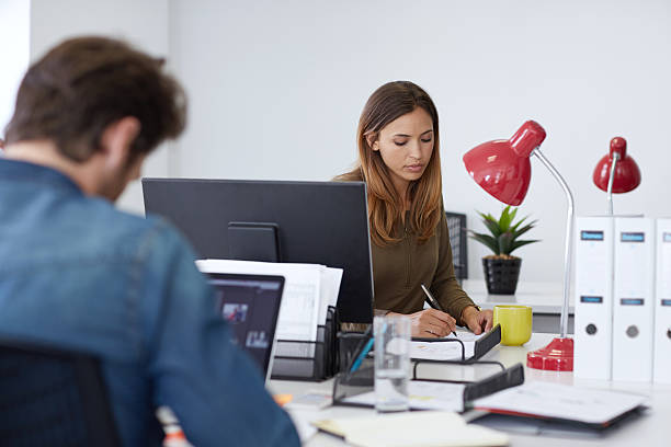 istock Working hard to meet their deadline 483456408