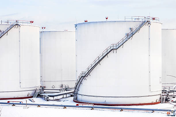 istock white tanks in tank farm with snow in winter 483458862