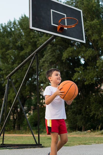 istock Father and son playing basketball 483463112