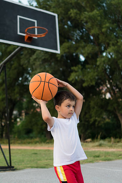 istock Father and son playing basketball 483463116