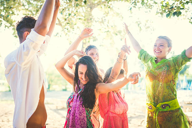 istock Friends enjoy sunset on the beach 483464750