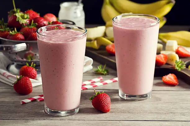 Photo of Two Strawberry Banana Yogurt Smoothies in Glasses with Ingredients