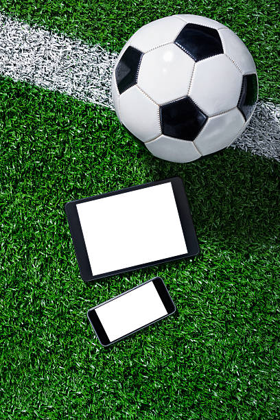istock Smart Phone and Digital tablet in front of soccer ball 483467814