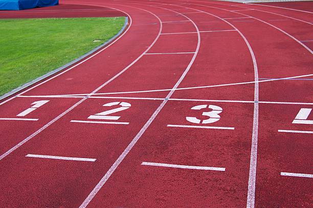 istock Red running racetrack on the athletic stadium 483468516