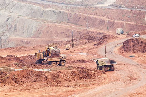 istock Part of a pit with big mining truck working 483474250