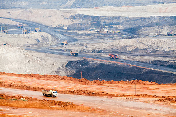 istock Part of a pit with big mining truck working 483476256