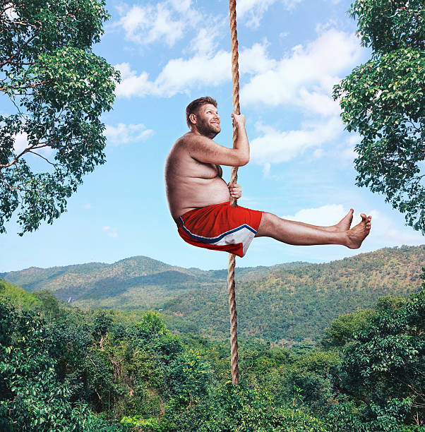 istock Man flying in the air by rope 483476828