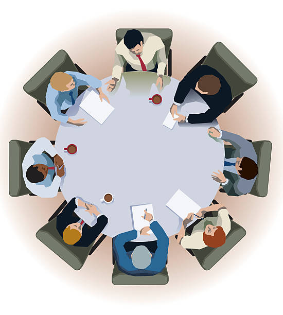 Round table interview Vector illustration of an interview/conference being conducted at a round table. Overhead view. conference table stock illustrations