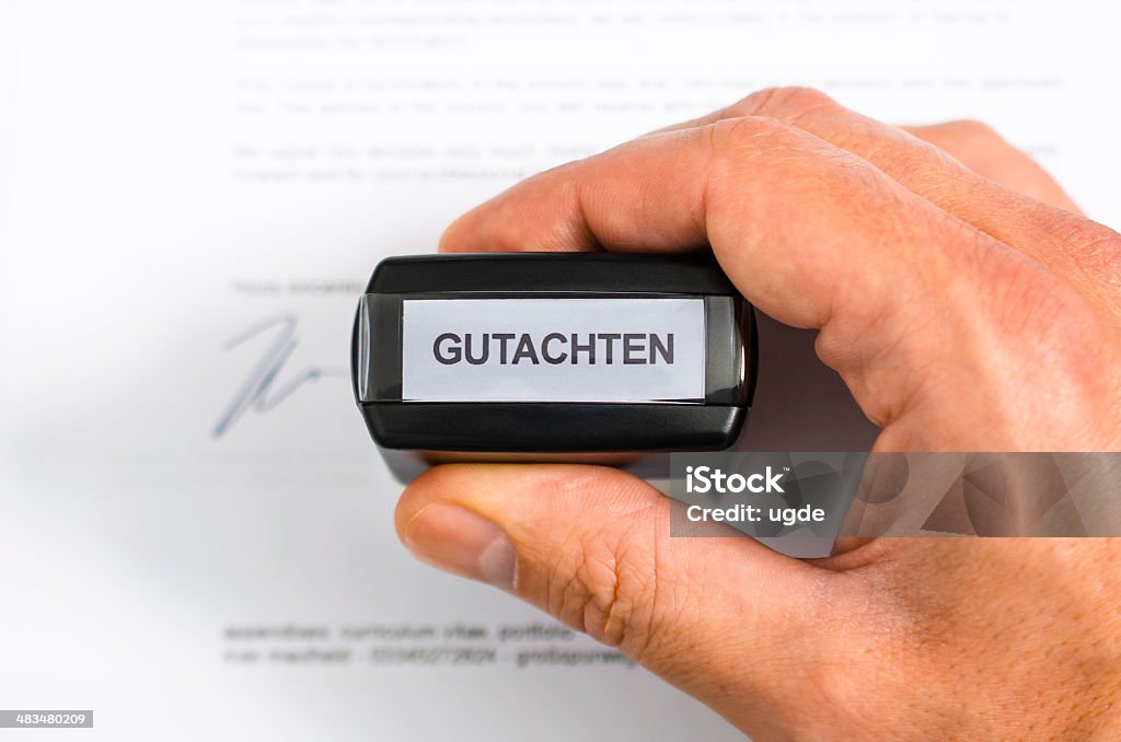 Rubber stamp expertise Document with german "Gutachten" rubber stamp Achievement Stock Photo