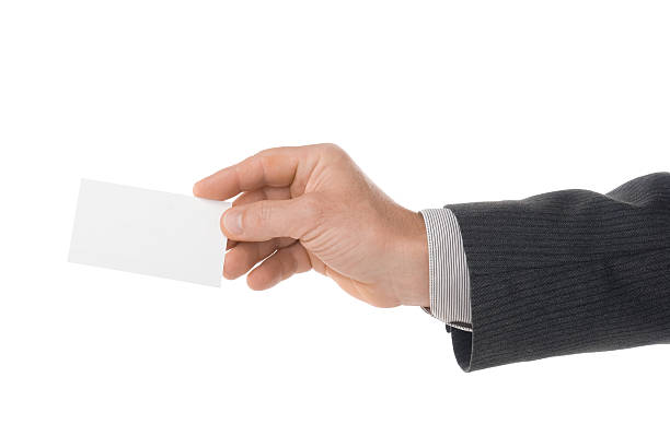 istock Business card in hand isolated on white 483480223