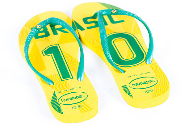 Havaianas World Cup Edition - Brazil WAKEFIELD, UK - MARCH 4, 2014 - Havaianas World Cup Edition - Brasil. Popular Brazilian flip-flop brand made by Alpargatas. Isolated on a white background. football2014 stock pictures, royalty-free photos & images