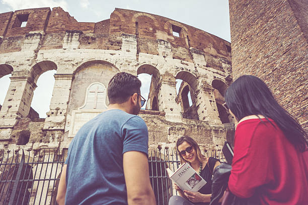 istock Tourists with a guide in front of the Coliseum, Rome 483482562