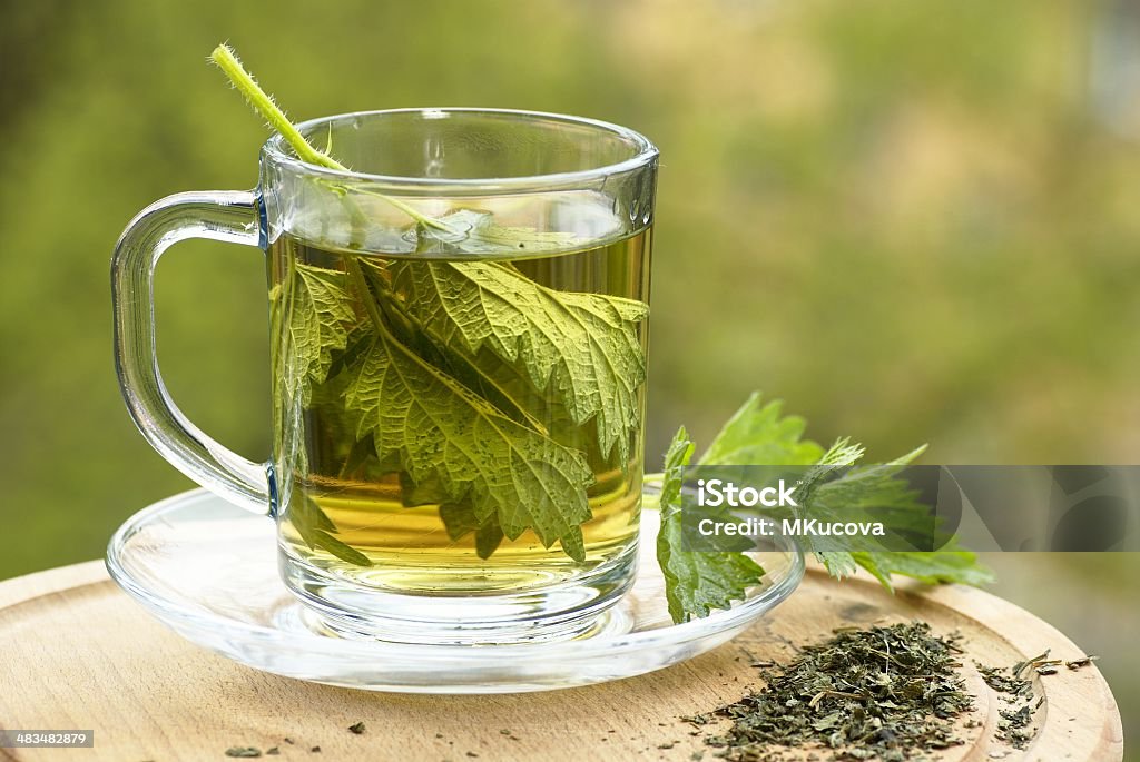 Nettle tea Nettle tea in glass. Fresh and dry nettle. Stinging Nettle Stock Photo