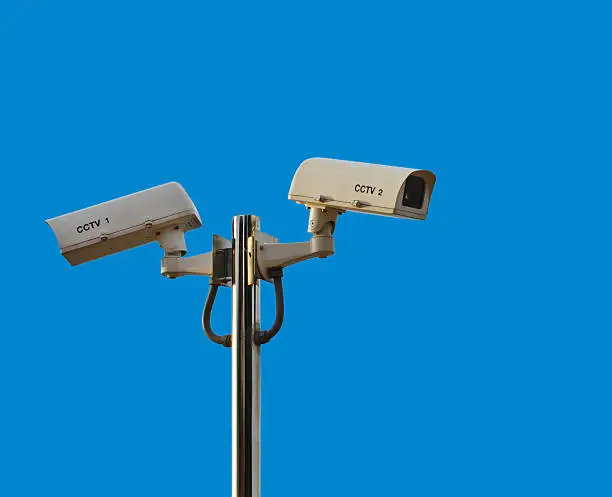 CCTV for security in the city on blue background.