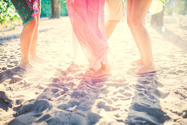 istock Friends enjoy sunset on the beach 483485478