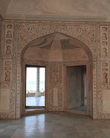 decorated arch entrance in Agra fort, India