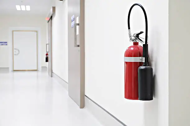 Photo of Install a fire extinguisher on the wall in buiding
