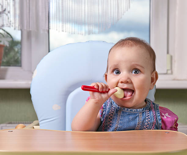 istock little girl with spoon 483486394