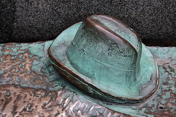 Statue hat worn-iron details.