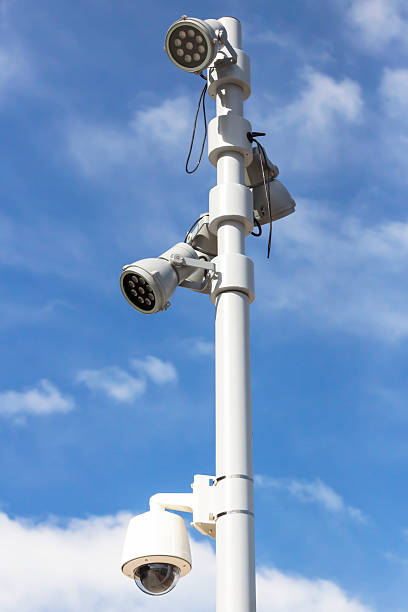 istock Modern street lights and CCTV security camera, copy space 483495266