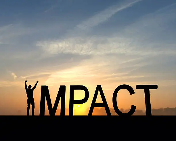 The word impact is silhouetted against an orange and blue sunset. The I in the word is made from a figure with their arms raised up in the air in a successful victory pose.